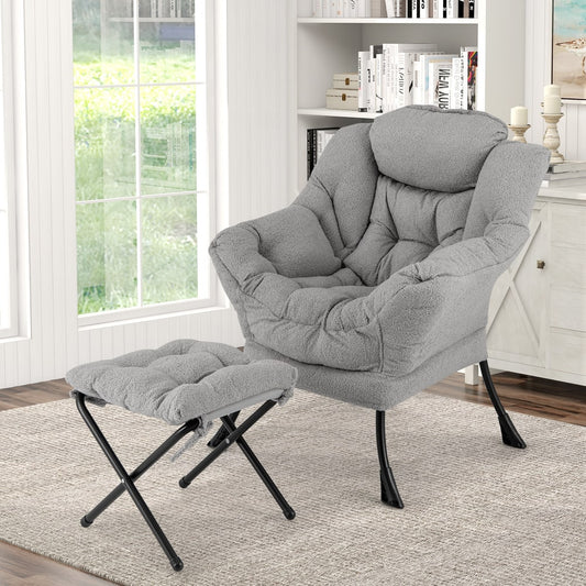 The accent chair and footstool are shown in a cosy living room setting with a bookshelf behind