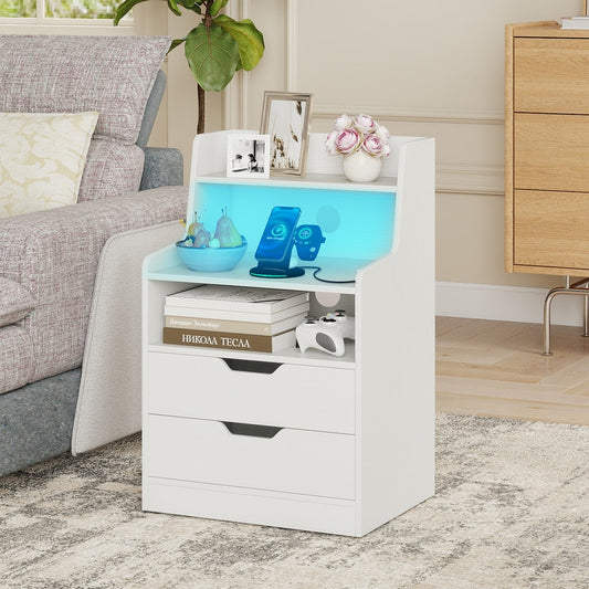 White bedside table with charging station and open shelf, shown next to a sofa