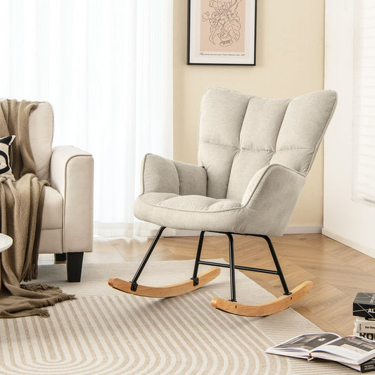 The modern rocking chair in a living room setting next to a sofa and rug