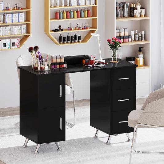 The manicure table set up in a salon with nail polish bottles and brushes on the surface