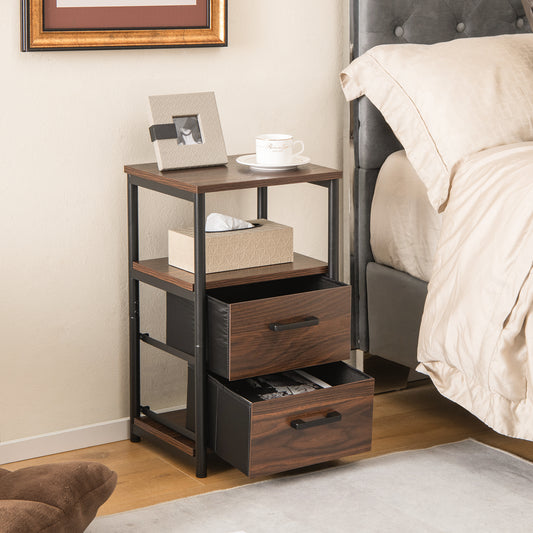 The end table placed next to a bed with both drawers pulled out and items on the top shelf