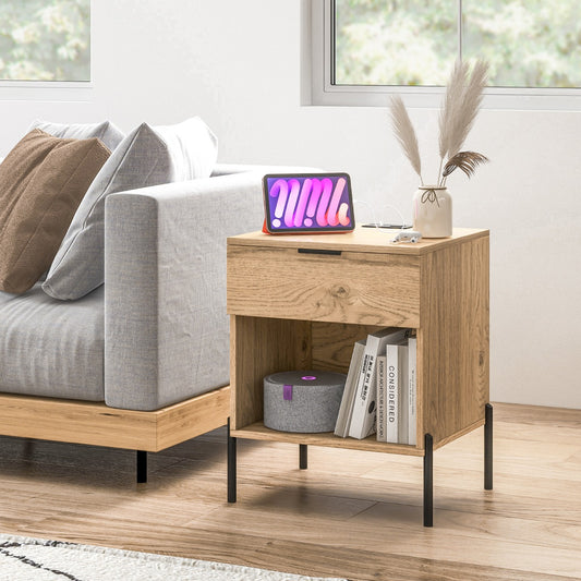 The wooden nightstand placed next to a grey sofa in a bright living room