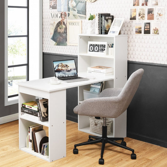 The office desk set up in a home study with a grey chair and laptop on the work surface