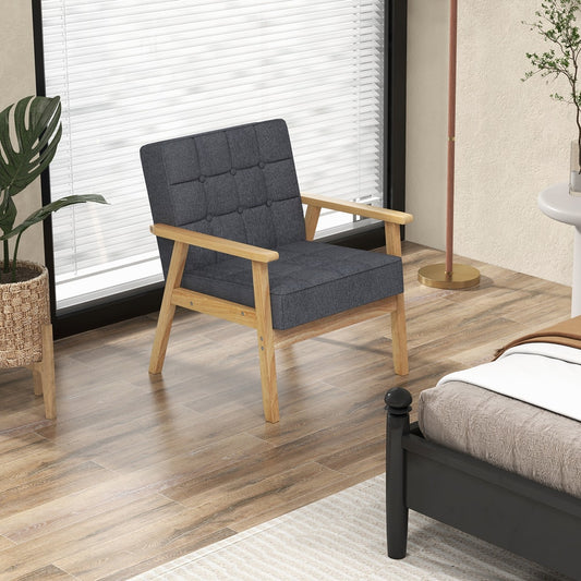 This accent chair is placed in a bright room next to a window and a bed
