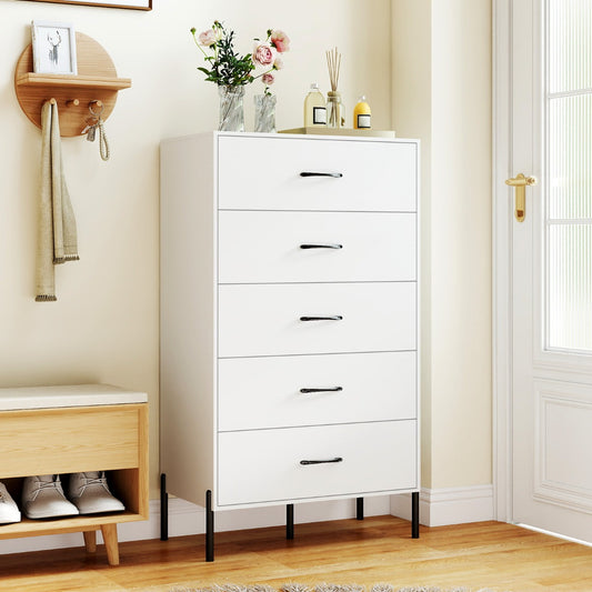 The tall chest placed in a hallway next to a door with decorative items on the top surface