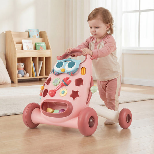 The baby walker being used by a toddler in a bright nursery room with wooden shelving in the back