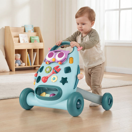The baby walker being pushed by a toddler across a wooden floor in a bright living room setting