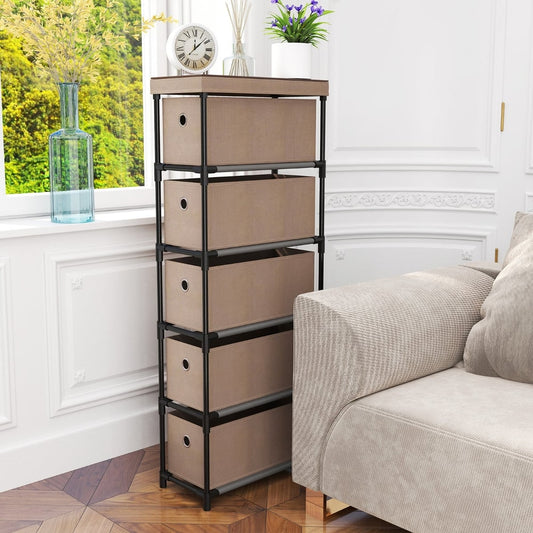 The narrow dresser with five drawers placed next to a sofa in a living room