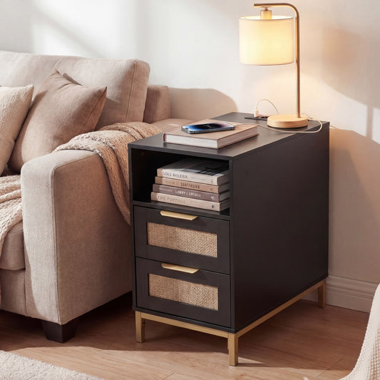The black bedside table with charging station is placed next to a sofa in a living room