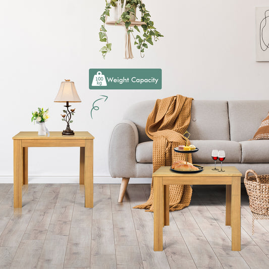 Two wooden side tables shown with a sofa and basket in a living room setting