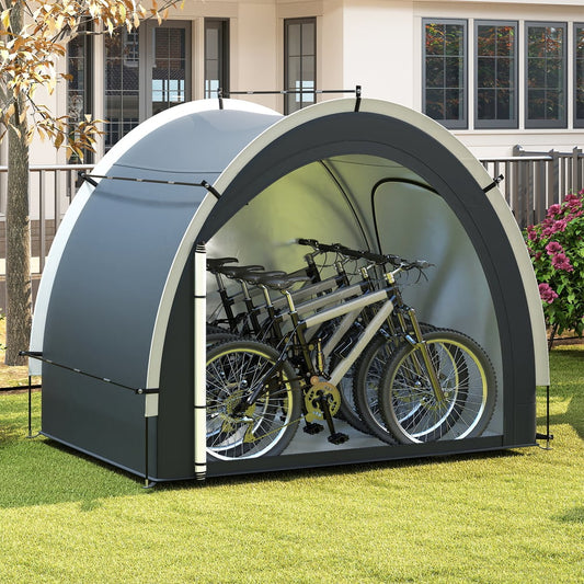 The outdoor bike cover tent with three bicycles stored inside, set up on a lawn