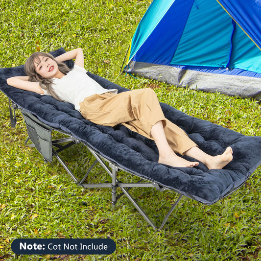 The sleeping pad placed on a folding bed with a person resting on it outdoors