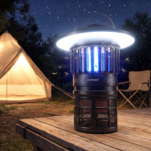 The camping furniture fly trap in use at night next to a tent