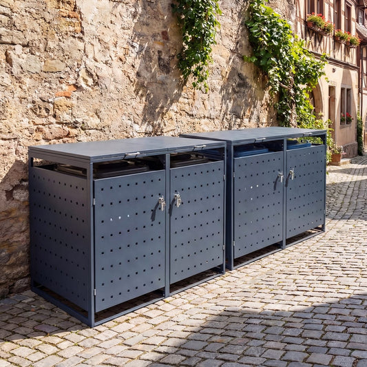 Two grey outdoor bin storage units side by side against a stone wall