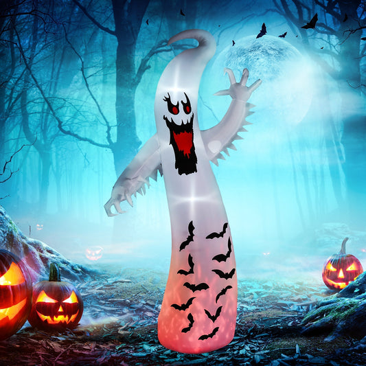 The inflatable ghost displayed in a spooky forest setting with glowing pumpkins on the ground