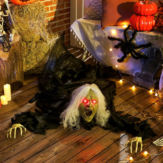 The crawling zombie displayed on a wooden floor with Halloween decorations and hay bales