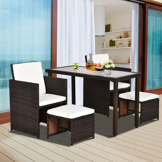 The brown rattan dining set with cushions arranged for outdoor dining on a patio