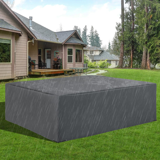 The protective cover placed over garden furniture on a lawn during a rain shower