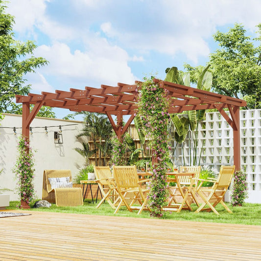 The wooden garden pergola kit set up in a garden with chairs and a table underneath, surrounded by plants and flowers
