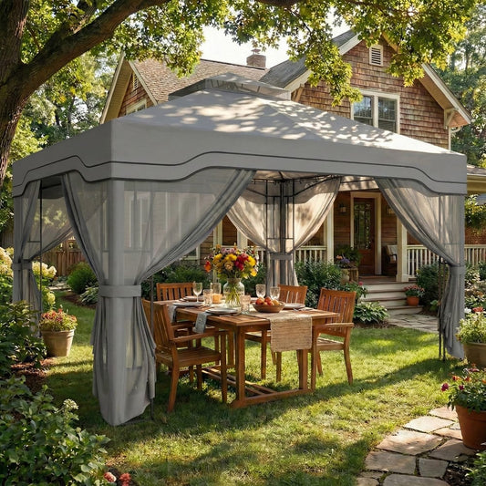 The garden gazebo set up with a table and chairs underneath in a sunny garden setting