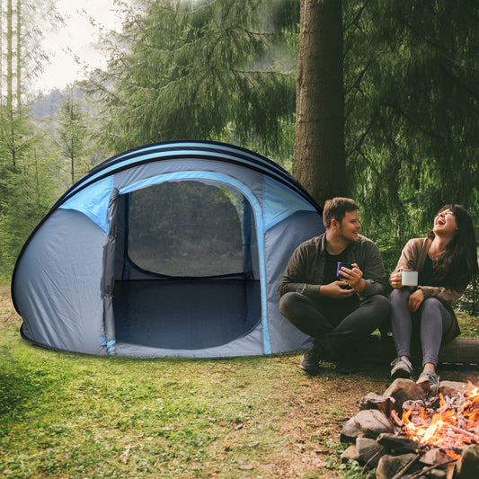 The camping tent set up in a forest clearing next to a couple sitting by a campfire