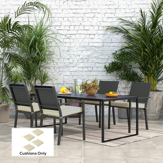 Four beige seat cushions placed on chairs around a patio dining table