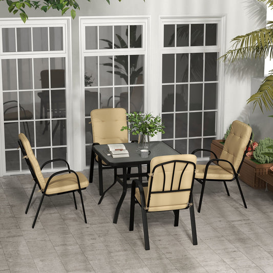 The outdoor dining set arranged on a patio with large windows behind
