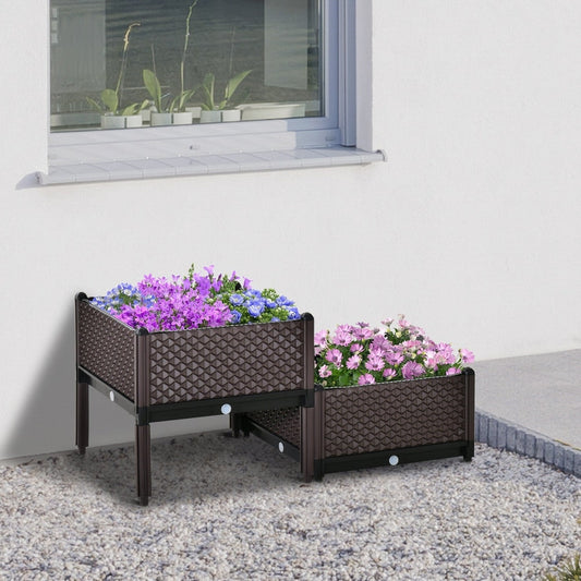The plastic raised garden bed planter box with flowers on a patio