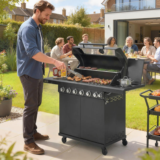 A man grilling sausages and burgers on the outdoor barbecue trolley at a garden party