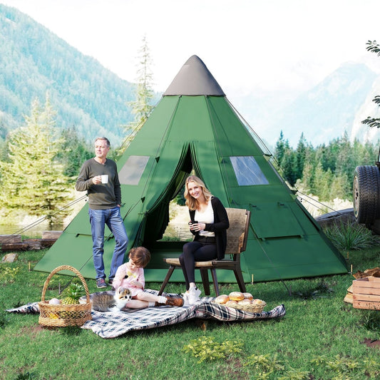 A family enjoying the green tipi tent pitched in a grassy area next to a lake