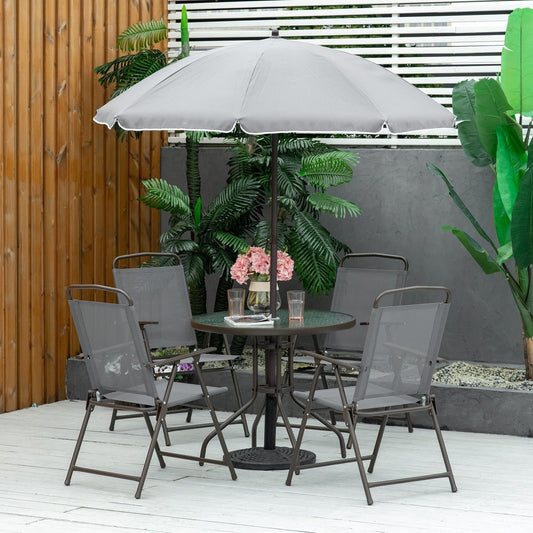 Grey garden dining set with parasol and four chairs arranged on a patio