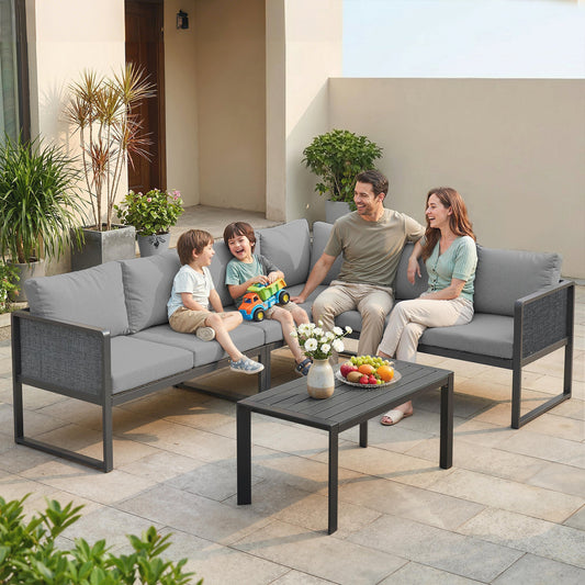 Family enjoying the metal garden furniture corner sofa set on a patio