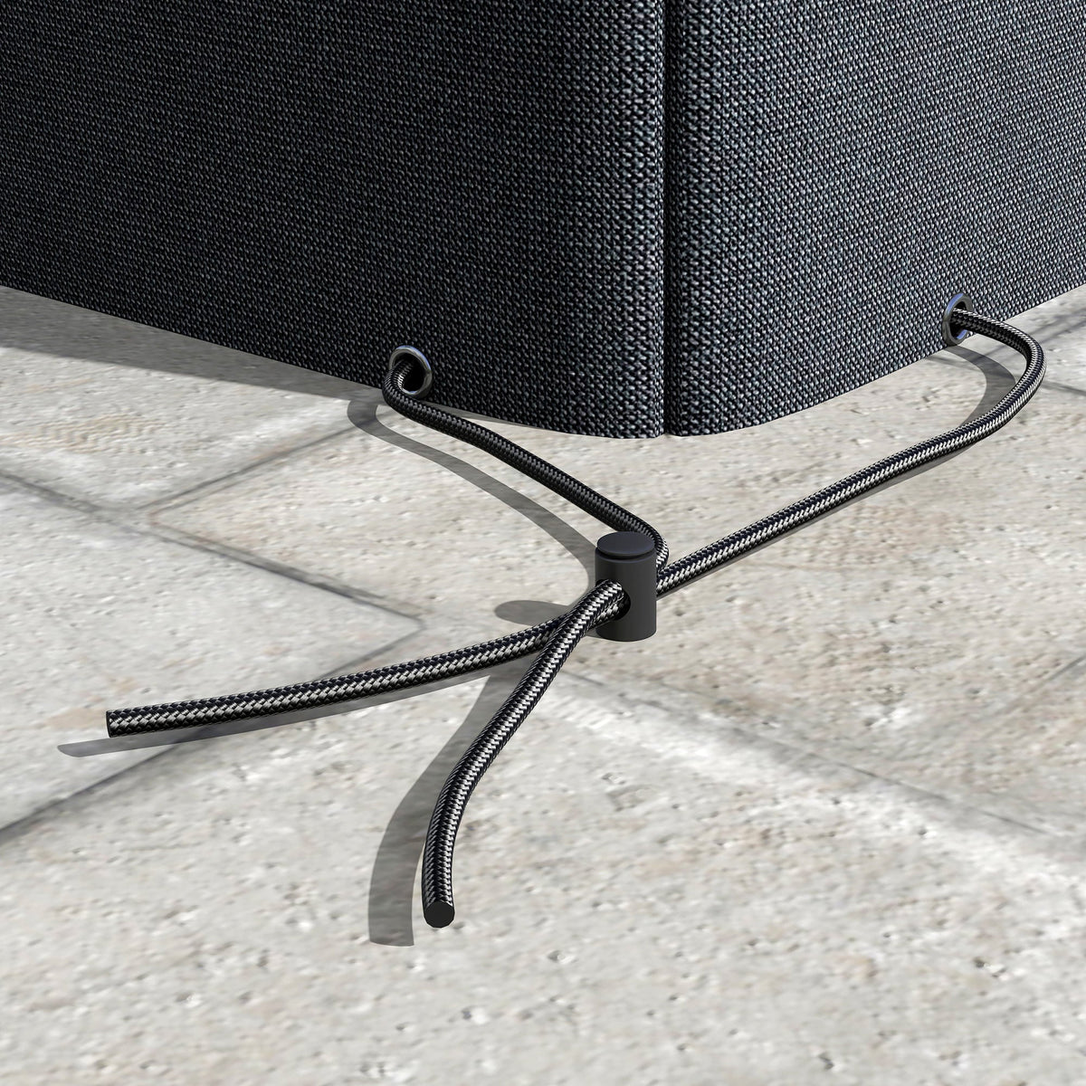 Close up of the adjustable drawstring and toggle on the furniture cover hem
