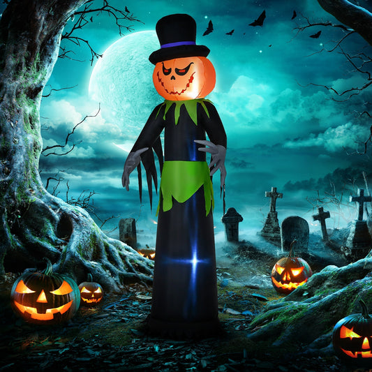 The tall Halloween inflatable pumpkin man decoration standing in a spooky graveyard at night