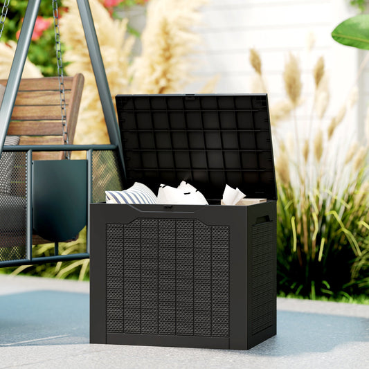 This black garden storage box is shown in use outdoors, holding cushions