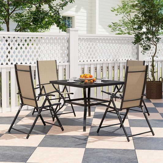Four chairs and a table set up on a patio for outdoor dining