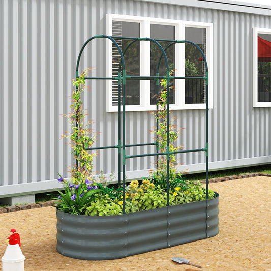 The metal raised bed filled with green plants and flowers standing on a patio
