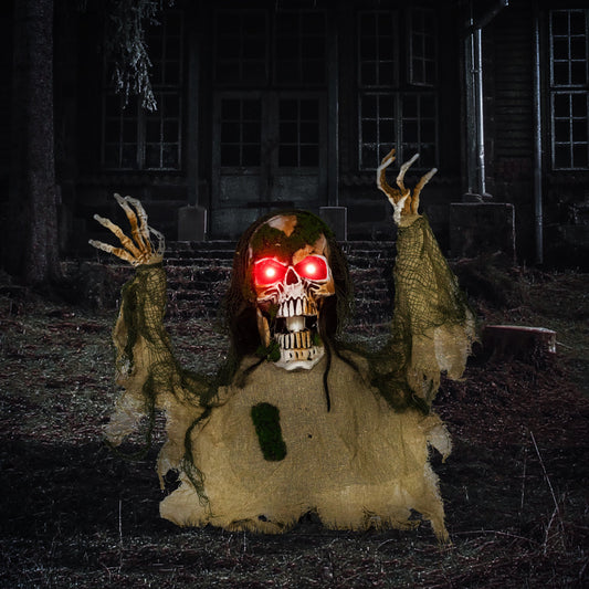 The halloween skeleton placed in a dark garden setting with glowing red eyes