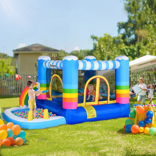 Children playing in the bouncy castle with trampoline and pool in a garden