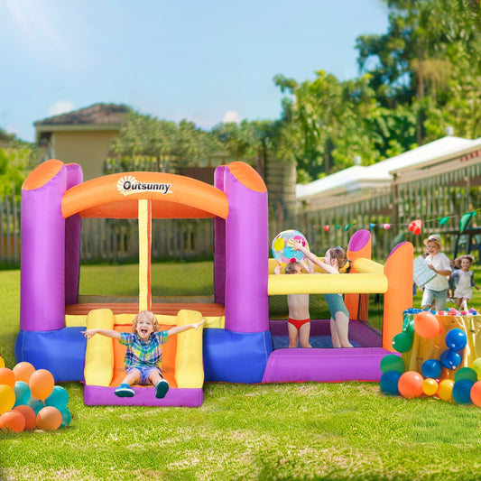 The bouncy castle house in use with children playing in a garden setting