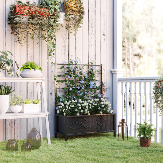 The galvanised raised garden bed with trellis filled with plants on a patio