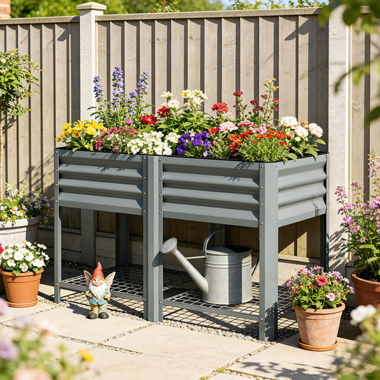 Galvanised raised garden bed filled with colourful flowers and a watering can nearby