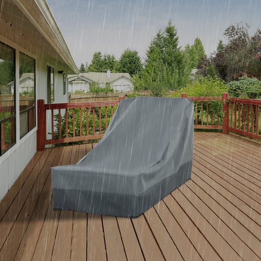 The grey patio furniture cover protecting a chaise lounge on a wet wooden deck