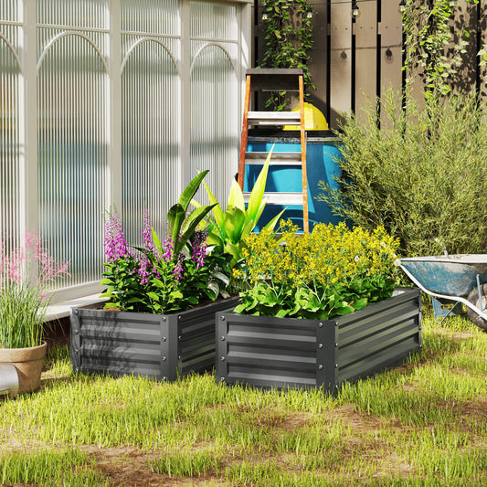 The steel planter boxes filled with colourful flowers and plants in a garden setting