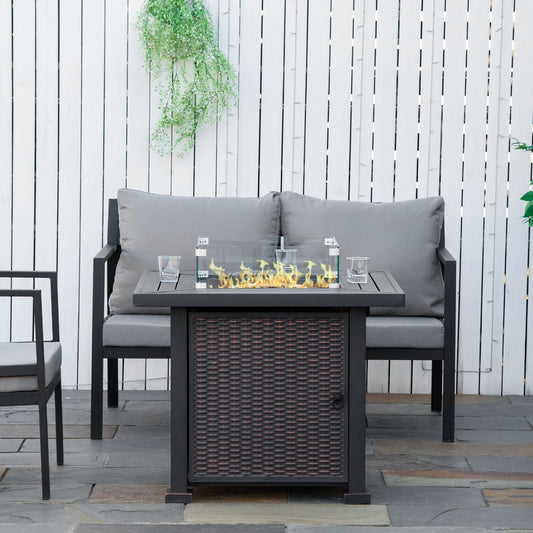 The square propane gas fire pit table is lit and in use on a patio with seating
