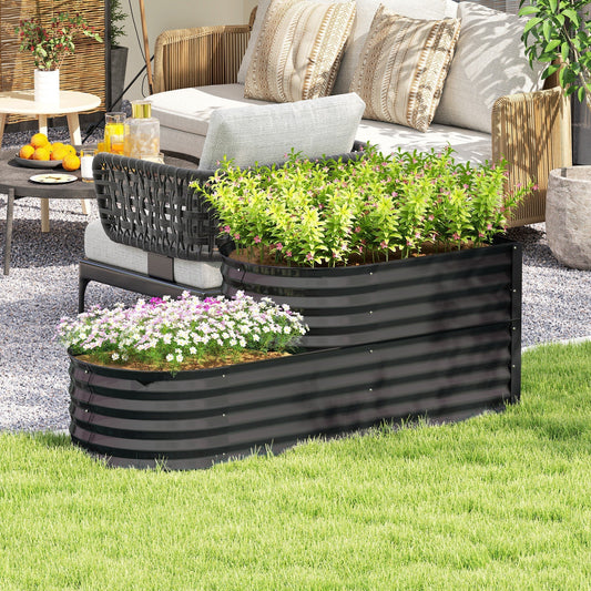 The two-tier galvanised raised garden bed filled with plants on a patio