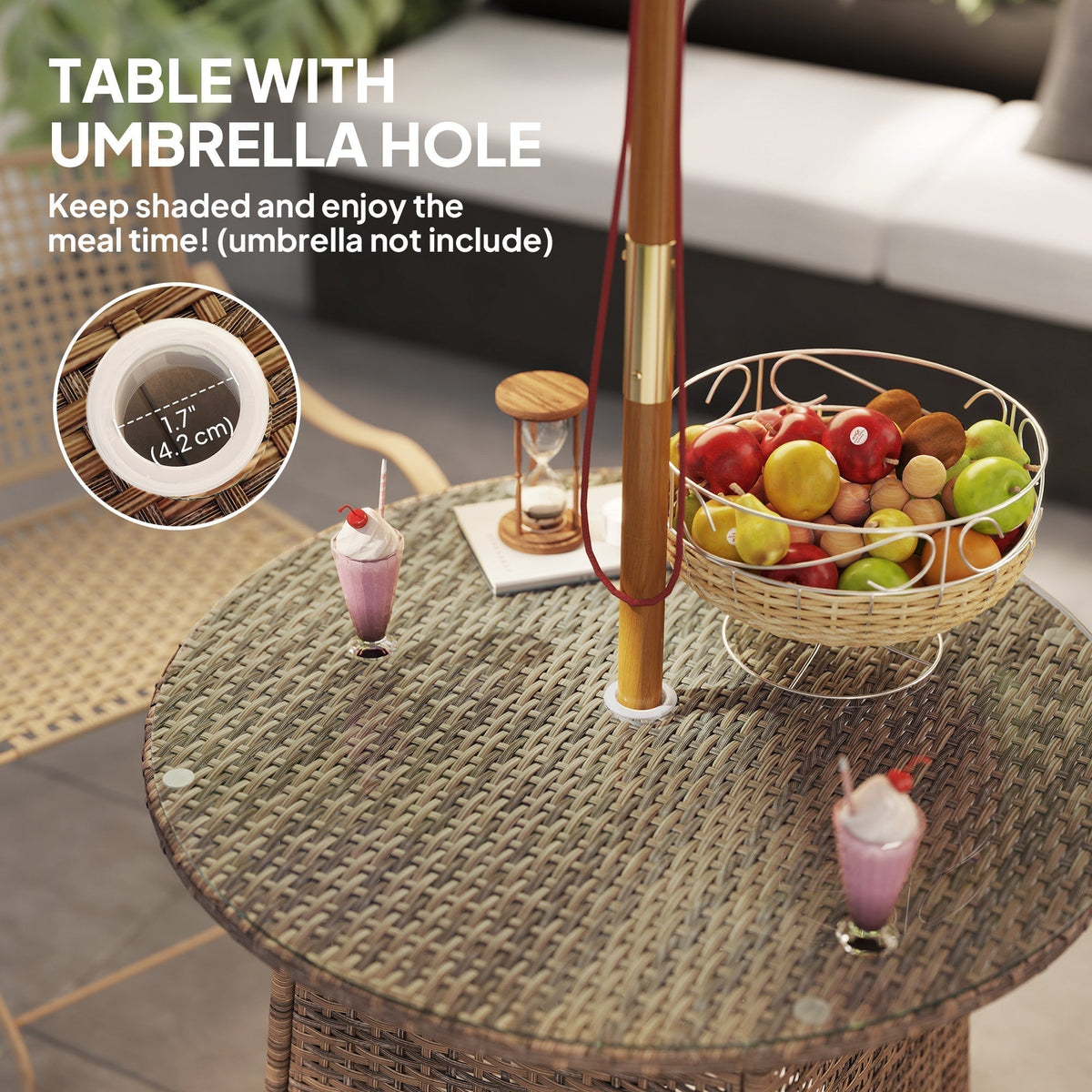 The rattan furniture top surface showing the umbrella hole with a bowl of fruit and drinks