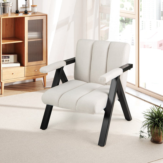 White upholstered accent chair with black metal frame and armrests in a bright room setting