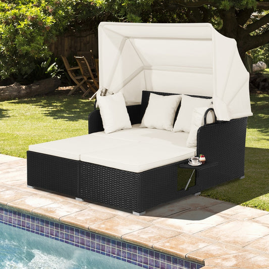 The patio furniture set next to a swimming pool on a sunny day