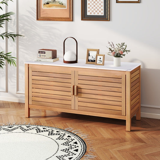 The outdoor storage cabinet placed in a living room with decorative items on top